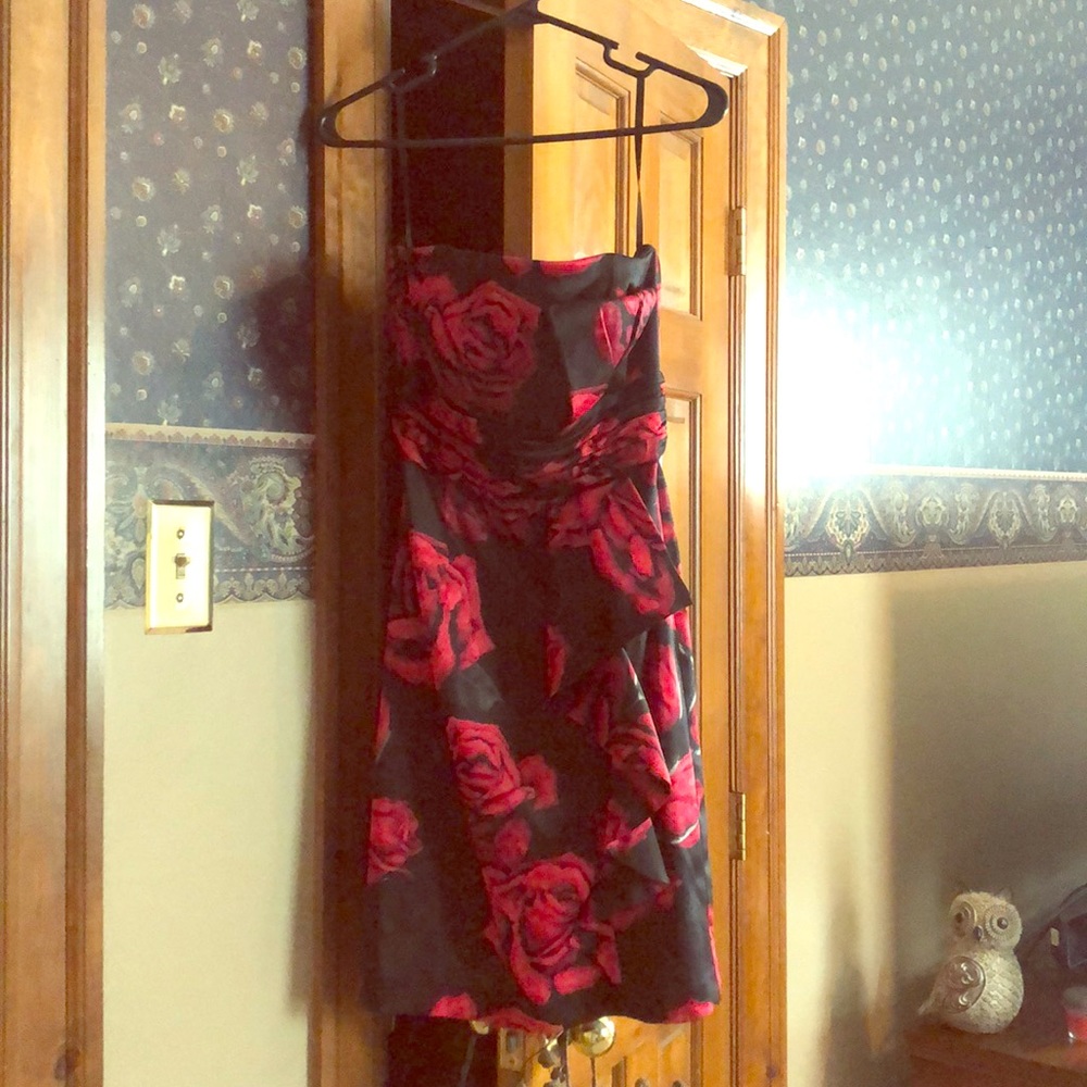 Black strapless dress with red roses.